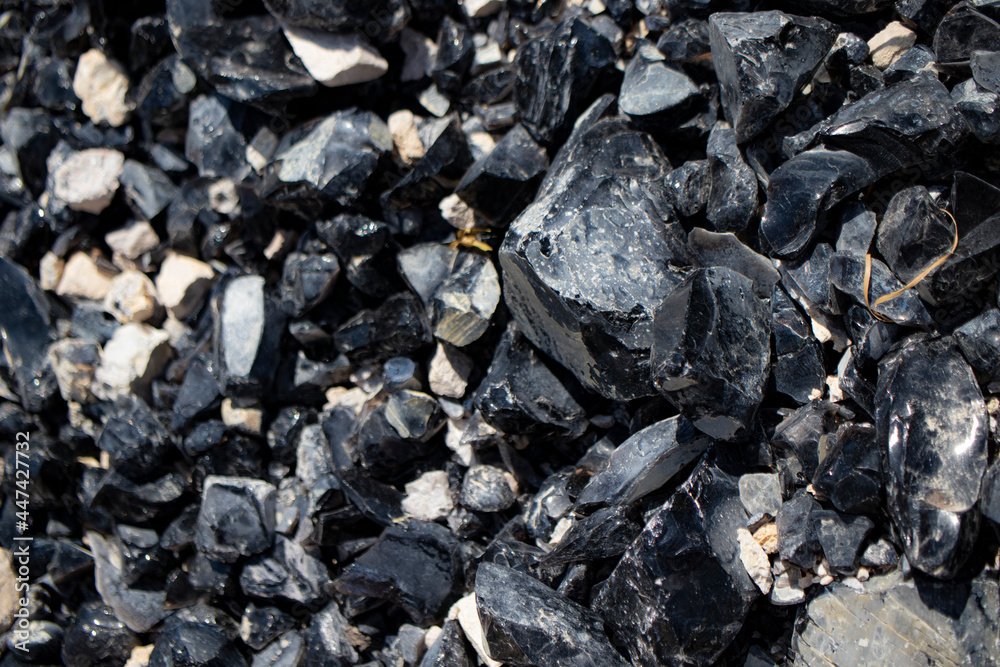 Obsidian stone mine, close-up. Obsidian stone mine, close-up.