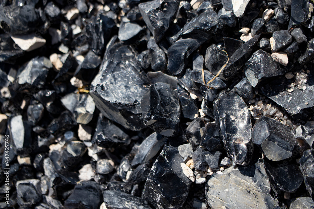 Obsidian stone mine, close-up. Obsidian stone mine, close-up.