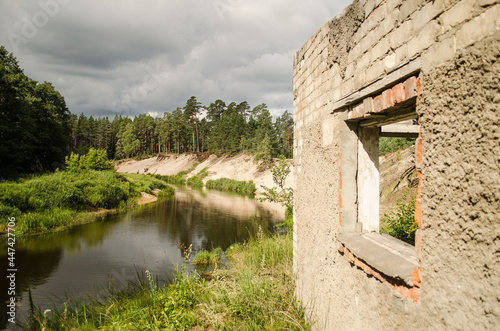 Irbe river, beautiful steep banks and abandoned military object, Latvia. photo