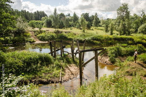 Remains of an old wooden bridge by the Irbe river, Latvia.