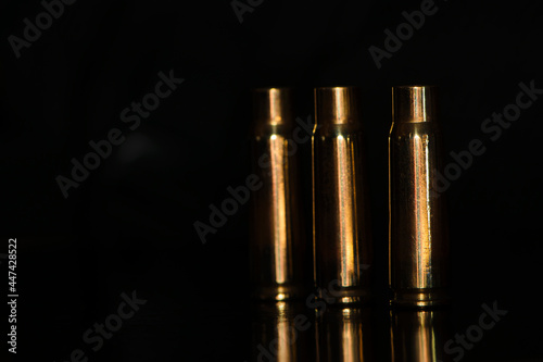Fotografi spent cartridges on a black background