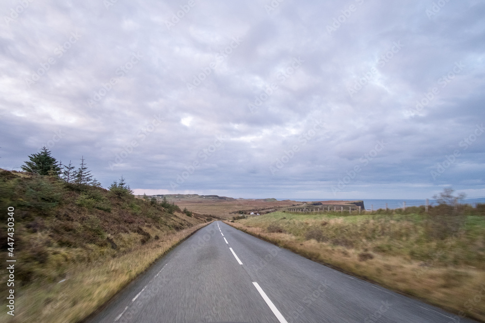 Road with Scenic Landscape View of Mountain, Forest in Scottish Highlands. Concept of Road trip, vacation.