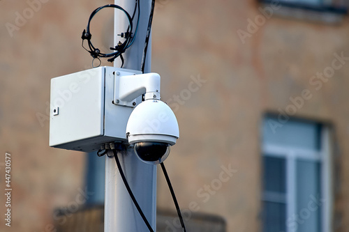 video surveillance camera mounted on a pole photo