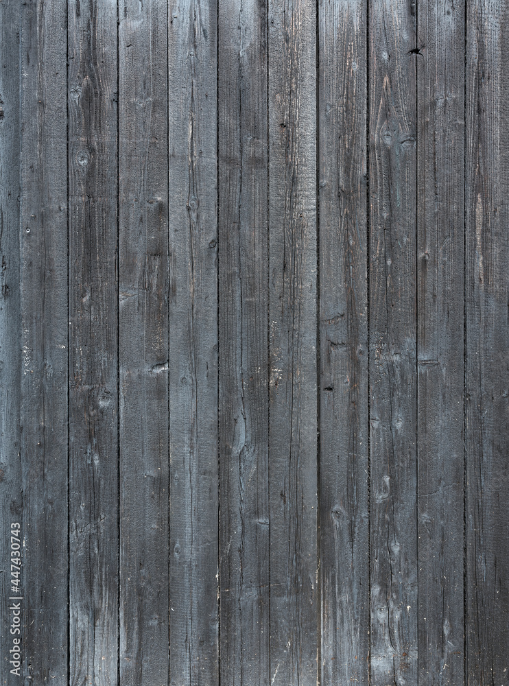 Fototapeta premium dark grey background of vertical wooden old grungy painted planks