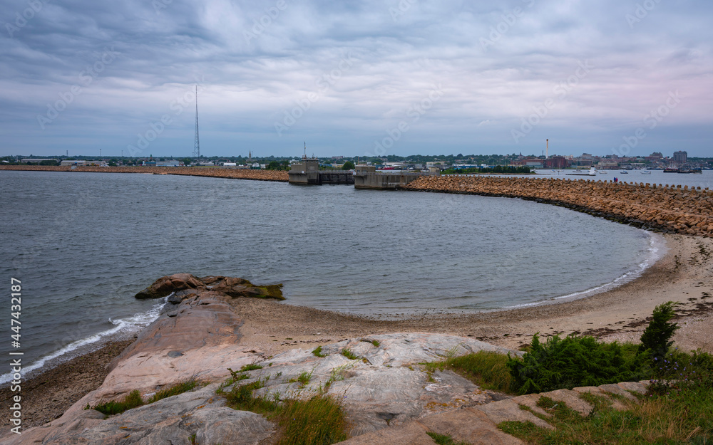 Seascape with Curved Cove, Hurricane Barrier, and Harbor Walk in New Bedford, Massachusetts. View of the Acushnet River from Fort Phoenix Summit.