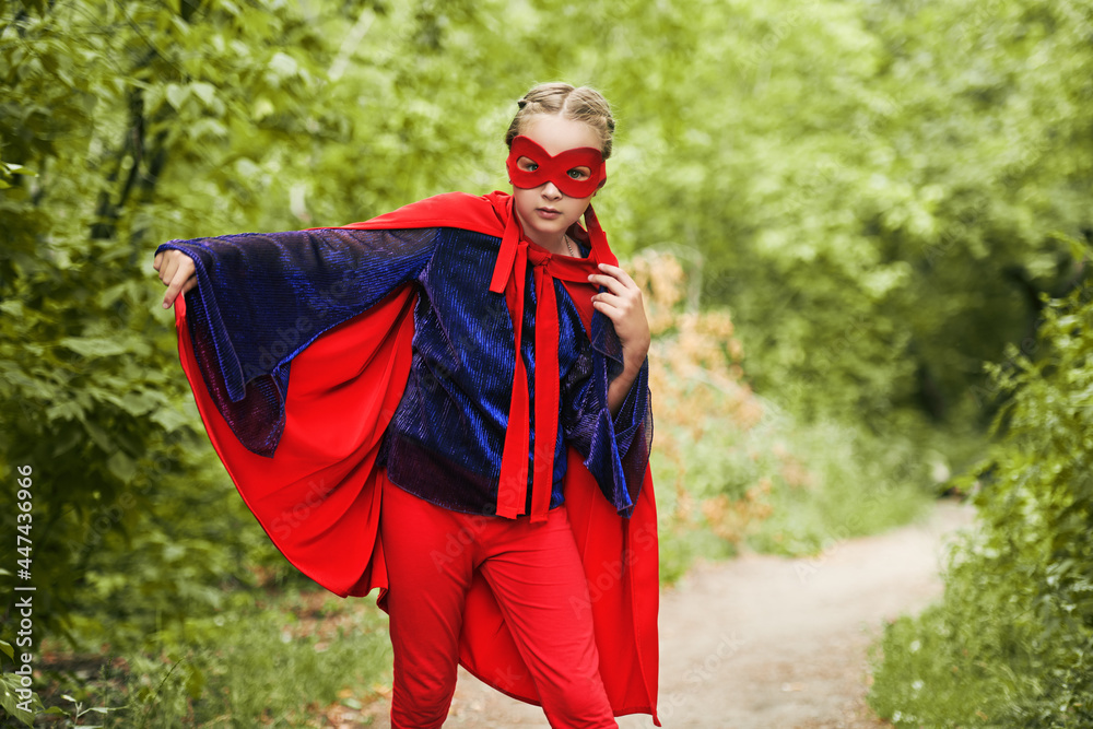 funny girl in costume of superhero