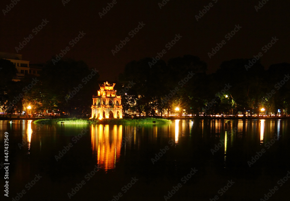 Beautiful scenic view of Sword Lake and Temple Of Literature's island at night time in Old Hanoi, North Vietnam, Indochina