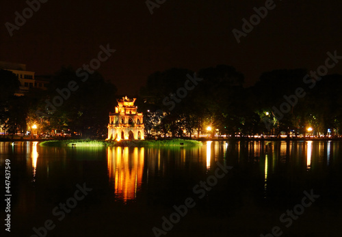 Beautiful scenic view of Sword Lake and Temple Of Literature's island at night time in Old Hanoi, North Vietnam, Indochina