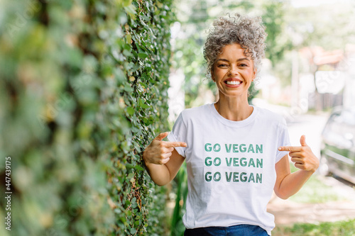 Fotografie, Obraz Happy vegan activist advocating for veganism outdoors