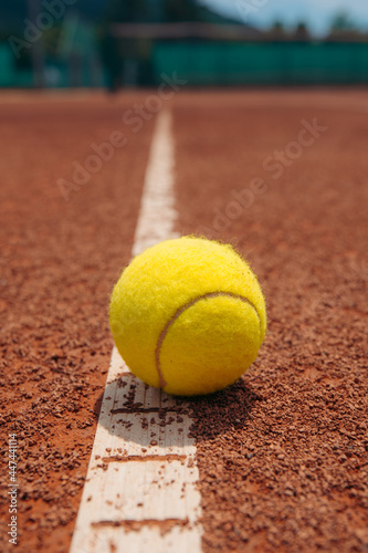 tennis ball on the court © Marko