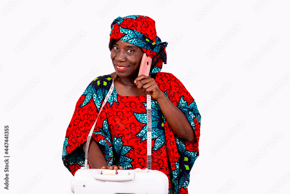 portrait of a seamstress having a conversation on the cell phone portrait of a seamstress having a conversation on the cell phone