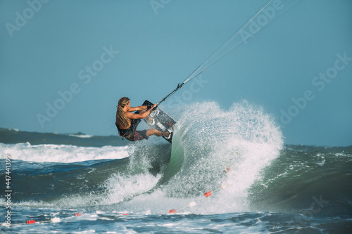 A kite surfer rides the waves © Oleg