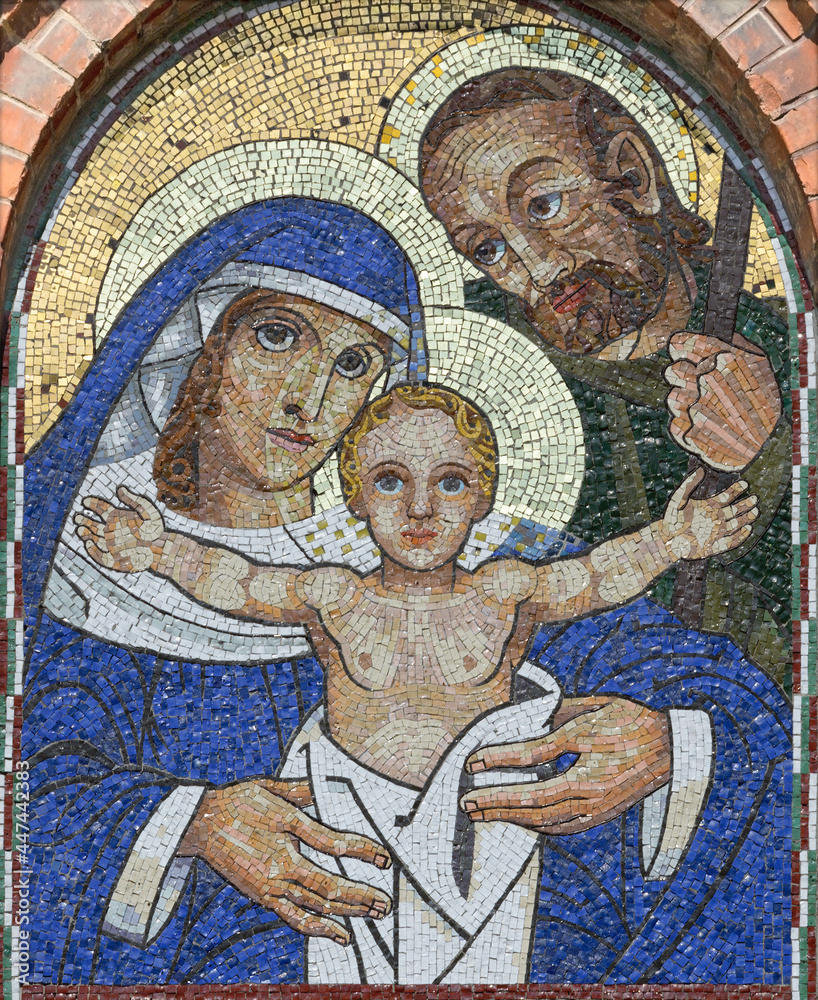 VIENNA, AUSTIRA - JULI 5, 2021: The mosaic of Holy Family on the facade of St. Anthony church from begin of 20. cent..