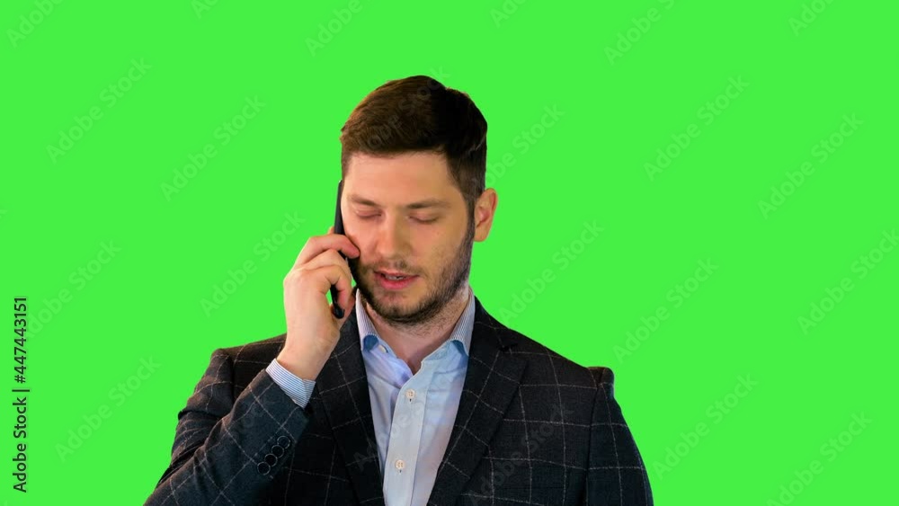 Bearded businessman talking on phone, manager look up serious answer boss questions on mobile call on a Green Screen, Chroma Key. Bearded businessman talking on phone, manager look up serious answer boss questions on mobile call on a Green Screen, Chroma Key.