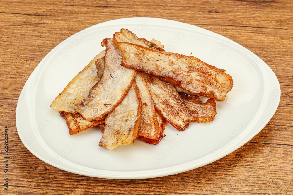 Roasted juicy bacon in the plate