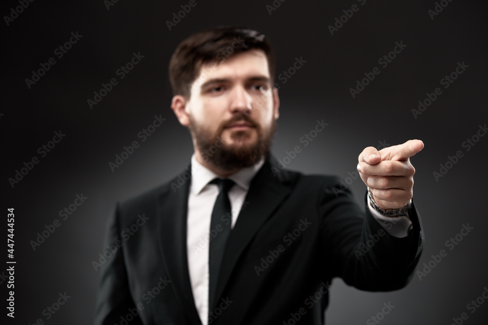 Businessman gesturing with finger forward Businessman gesturing with finger forward