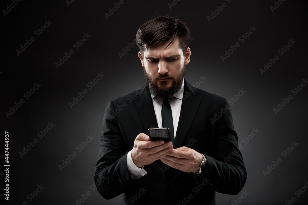 Businessman reading smart phone screen Businessman reading smart phone screen