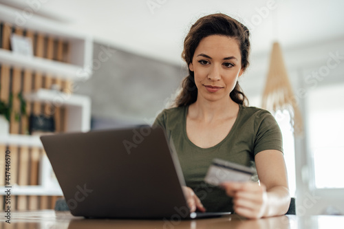 Young woman, making sure everything is fine in her bank.