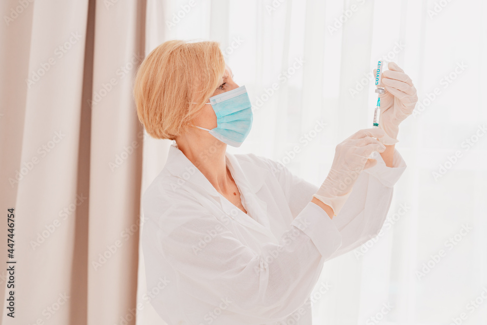 Doctor with syringe is ready to administer the vaccine against covid-19 Doctor with syringe is ready to administer the vaccine against covid-19