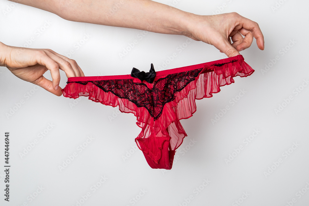 Women's hygiene and health. Red women's underwear. Glamorous and beautiful concept