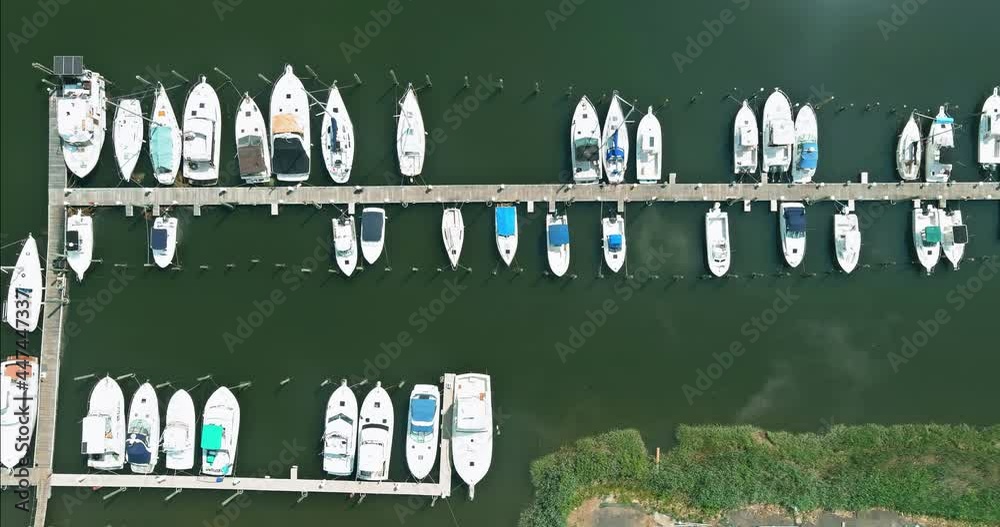 Aerial view boats in little port in ocean a little marina along the dockside Aerial view boats in little port in ocean a little marina along the dockside