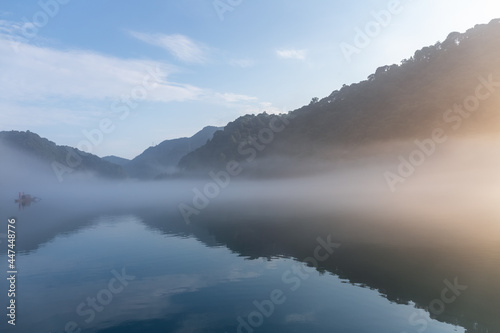 river covered with white fog in sunrise