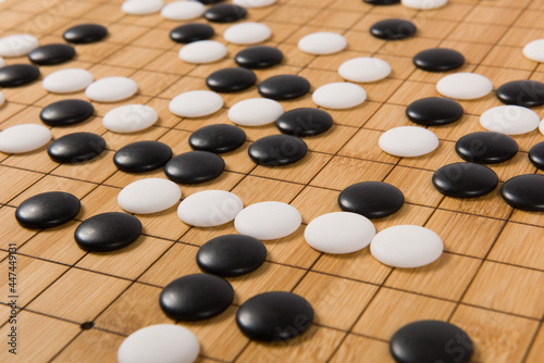 Desk for board game Go or Weiqi  and black and white bones. Traditional asian strategy boardgame