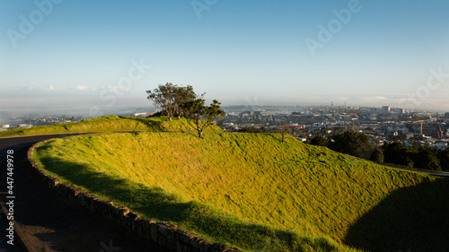 VVolcanic crater at the summit of Mt Eden with sweeping view over the Auckland city in the mist, New Zealand