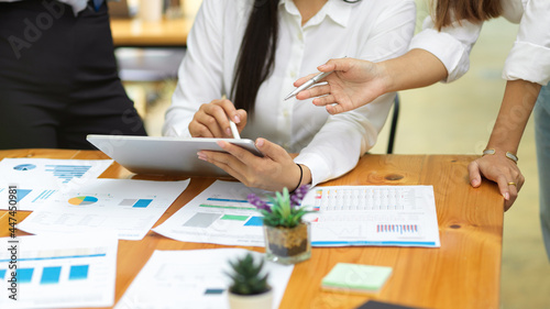 Business team summarise final business plan with tablet and financial reports, colleague teamwork, meeting concept