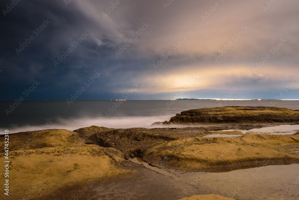Night landscape long exposition of rocky shore