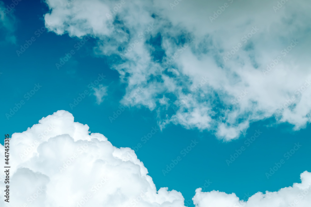 Blue sky background with Cumulonimbus and Cirrostratus clouds from below. Cumulus sky. Meteorology and Climate Concept. Blue sky background with Cumulonimbus and Cirrostratus clouds from below. Cumulus sky. Meteorology and Climate Concept.