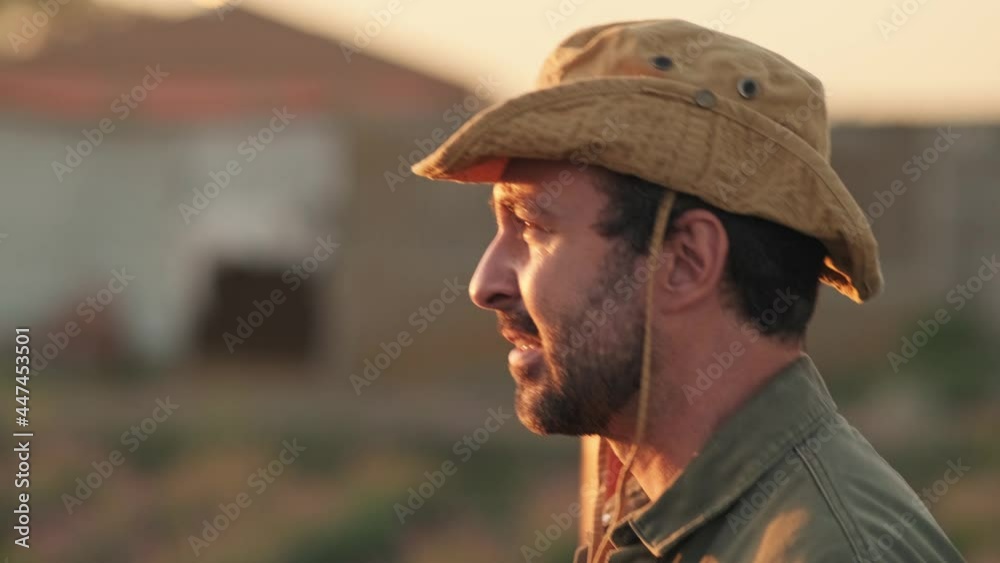 A side view of a farmer man is walking to the side in a village A side view of a farmer man is walking to the side in a village