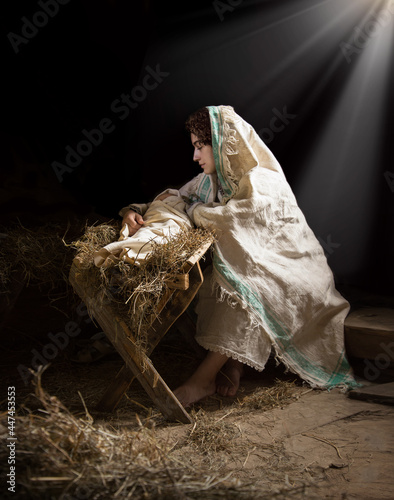 Valokuvatapetti Mary sits in the stable near the manger with the baby