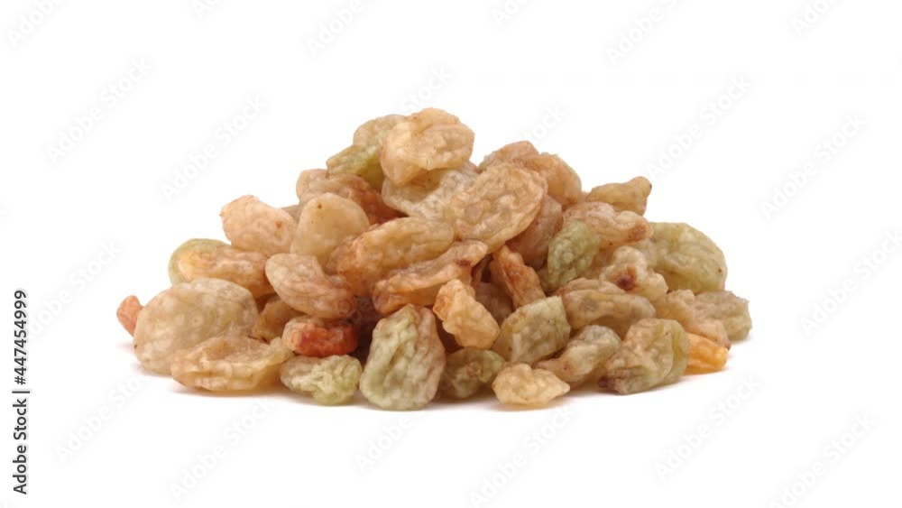 Close-up of isolated raisins rotating on white background.
Close-up of isolated raisins rotating on white background.