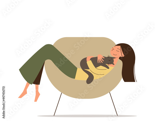Cute cartoon girl with a long hair lies on the chair with her cat. Happy young woman hugs a pet.