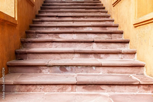 Building exterior stairs with antique red brown granite tiles