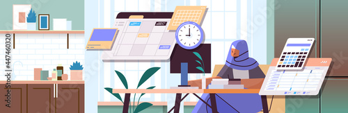 arab businesswoman at workplace planning day scheduling appointment time management concept