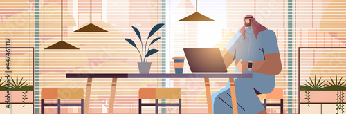 arab businessman sitting at workplace arabic business man freelancer working in creative office horizontal