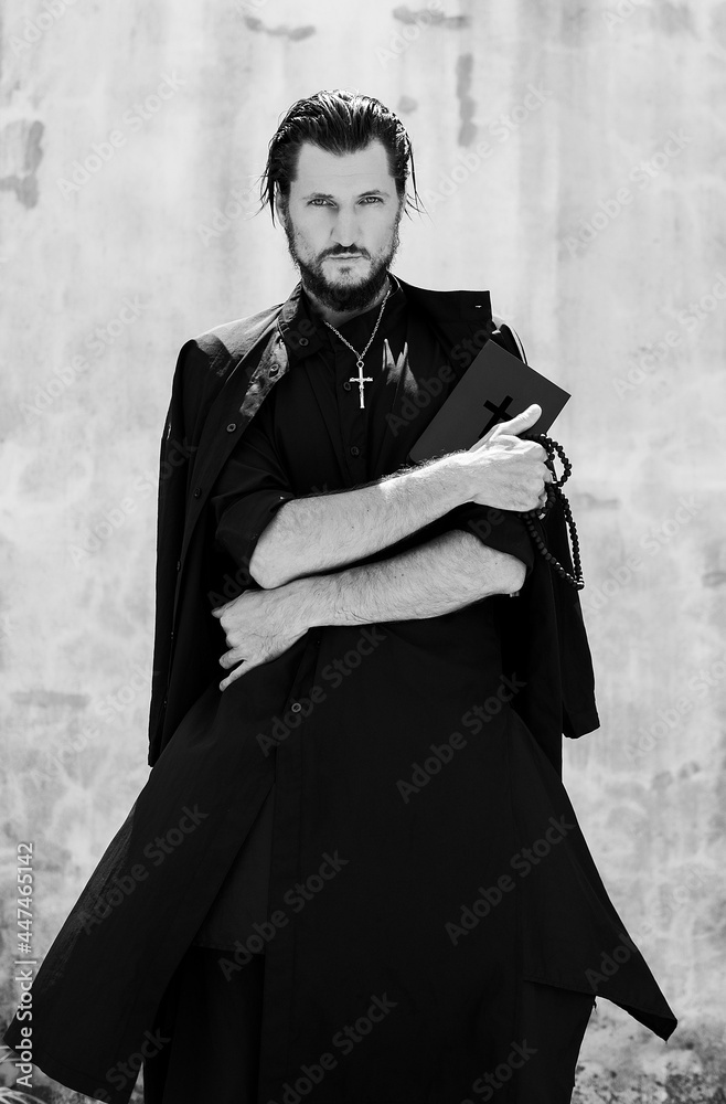 Holy father, priest prays on the bible, cassock, dignity, spiritual ...