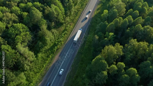 View from above on the road loaded with different modes of transport in the evening. Logistics. Transportation of groupage cargoes, delivery of products to the destination. High quality. 4k footage.