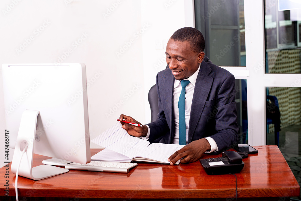 young serious businessman working in the office. young serious businessman working in the office.