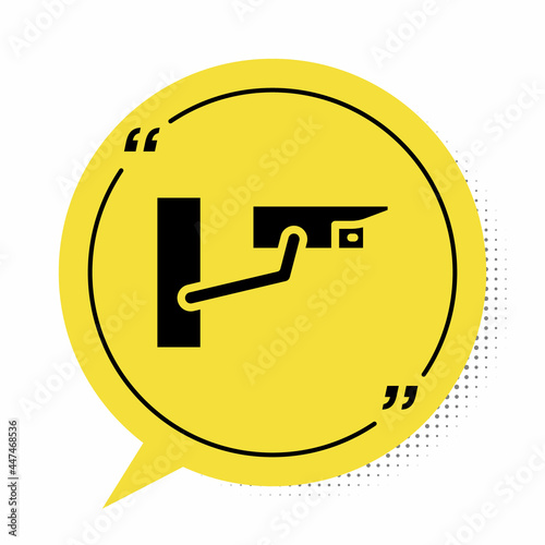 Black Security camera icon isolated on white background. Yellow speech bubble symbol. Vector