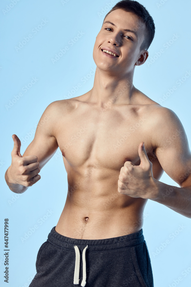 handsome man with biceps torso thumb smile model handsome man with biceps torso thumb smile model