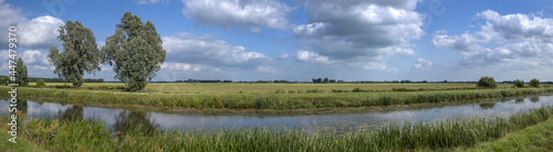Havelte Oude Vaart Drente Netherlands. Canal and meadows. Dutch landscapes. Clouds. Summer. Panorama. © A
