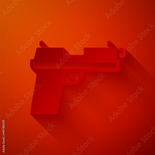 Paper cut Pistol or gun icon isolated on red background. Police or military handgun. Small firearm. Paper art style. Vector