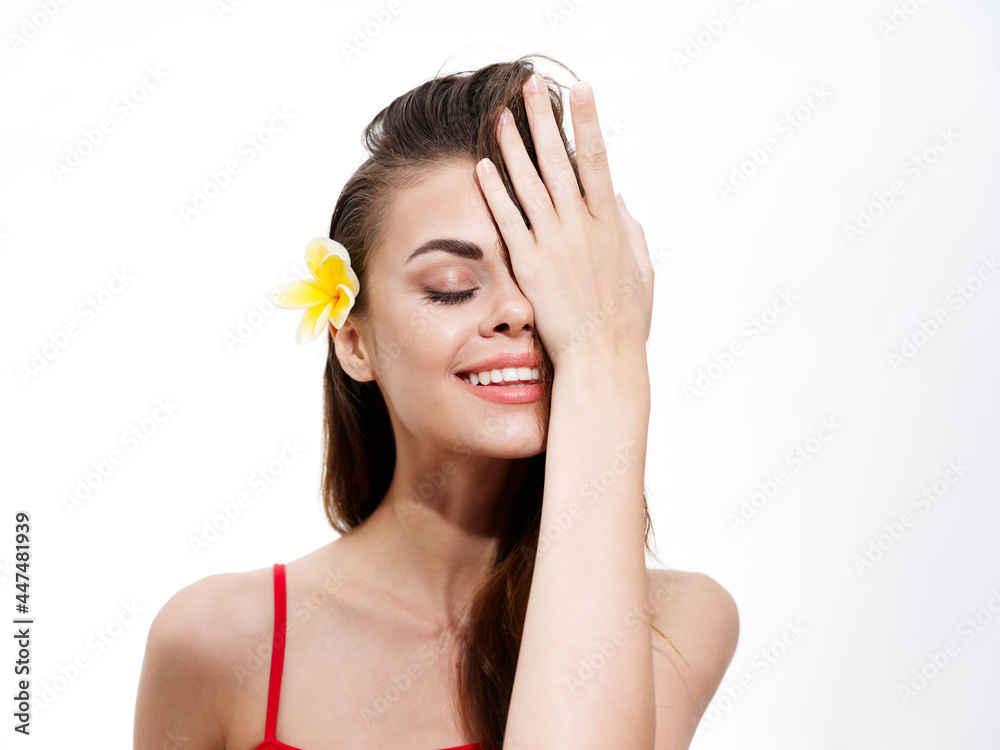 portrait of woman with yellow flower in her hair and happy face smile model portrait of woman with yellow flower in her hair and happy face smile model