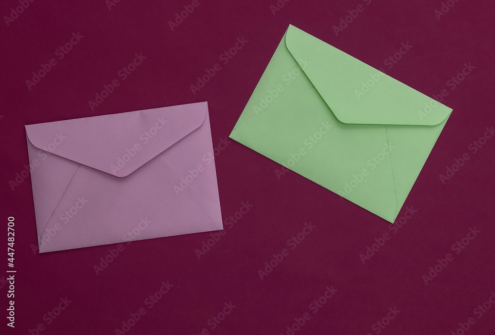 Envelopes on purple background. Top view Envelopes on purple background. Top view