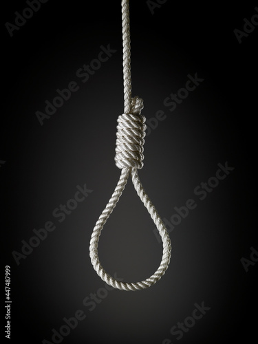 loop of white rope on a black background photo
