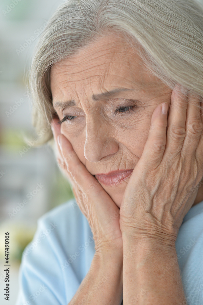 Portrait of sad senior woman with headache Portrait of sad senior woman with headache