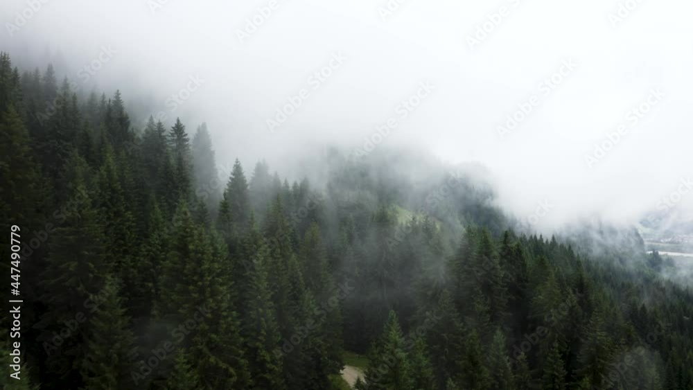 Flying through clouds near a mountain side Flying through clouds near a mountain side